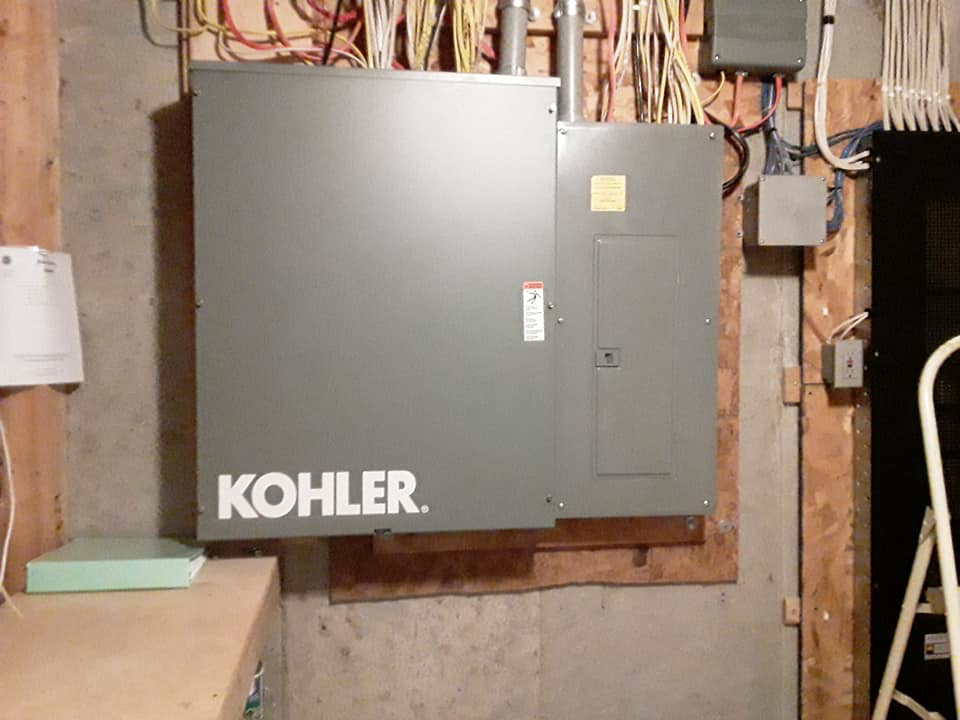 An outdoor Kohler standby generator unit installed by Bluegrass Power & Electric in Lexington, KY.