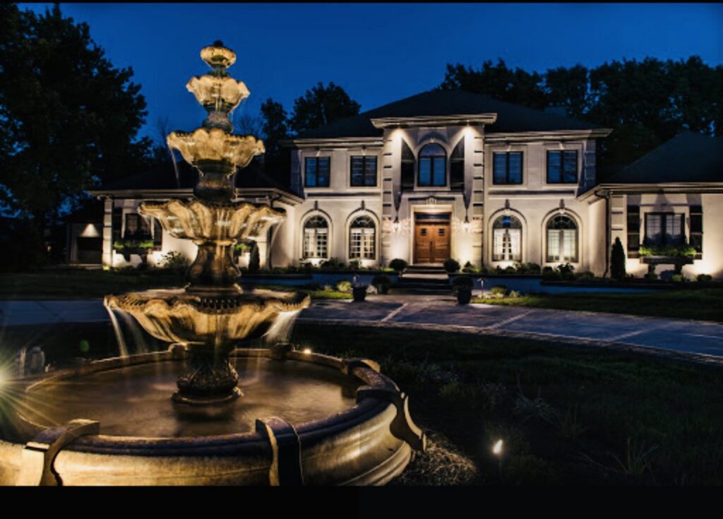 Beautiful outdoor landscape lighting and fountain installed by Black Bear Electric at a home in Aurora, CO.