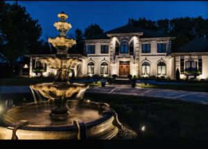Beautiful outdoor landscape lighting and fountain installed by Black Bear Electric at a home in Aurora, CO.