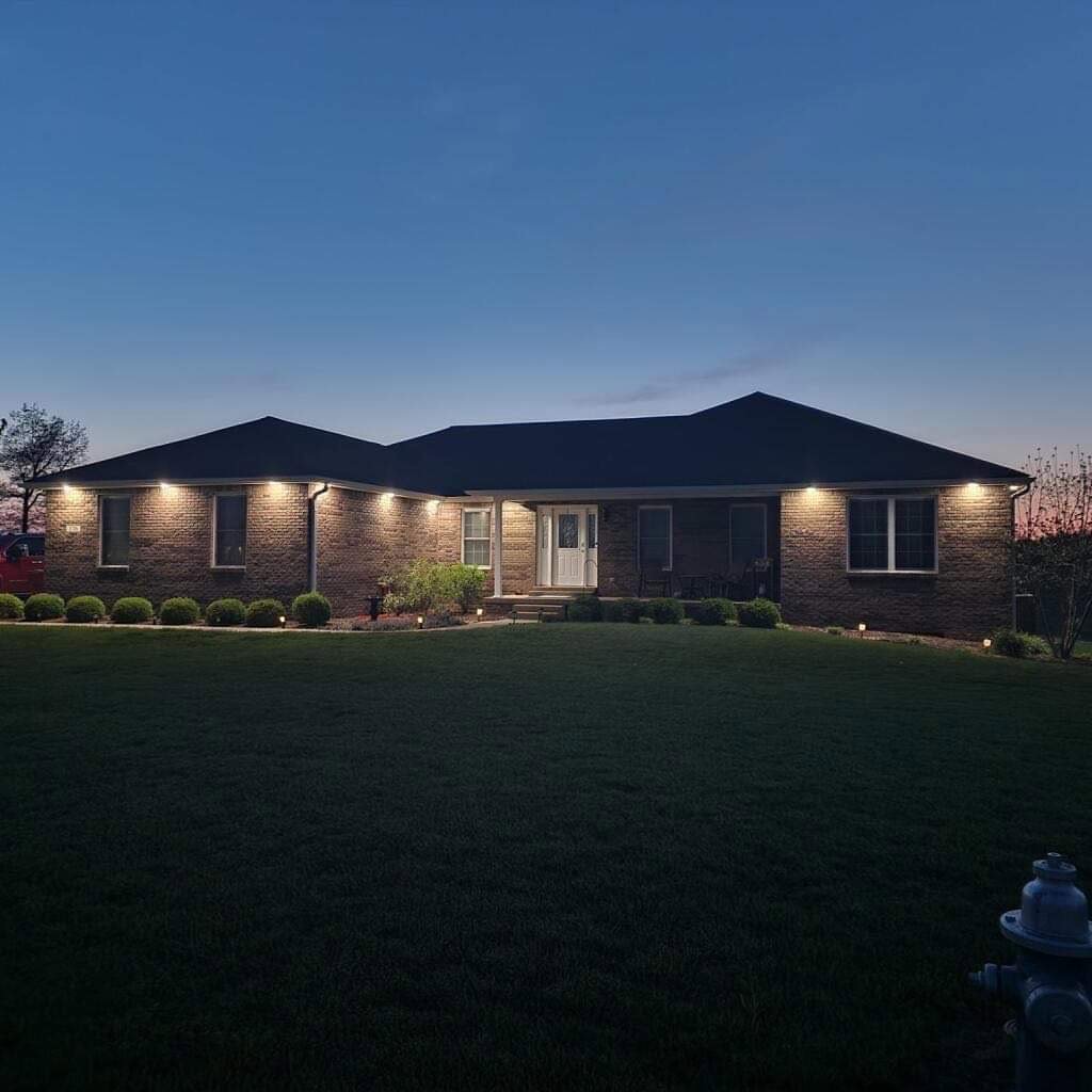 A beautiful residential exterior with professionally installed outdoor landscape lighting by TCB Electric LLC in Elizabethtown, KY.
