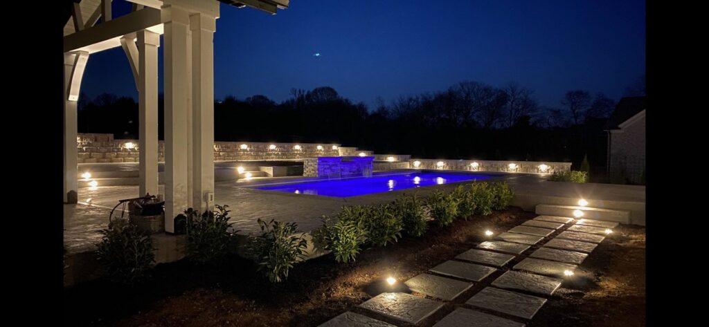 Beautiful outdoor landscape and pool lighting installed by Omilian Electric Inc. in Murfreesboro, TN