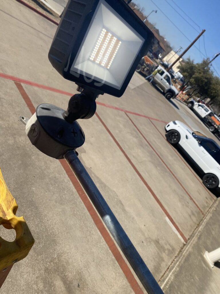 Outdoor LED floodlight installation for a commercial parking lot by No Shorts Electrical in Midlothian, TX.