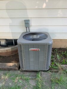 An outdoor Lennox air conditioning unit installed by Heating and Cooling Drs of Waukesha, Pewaukee, and Delafield, Waukesha, WI.