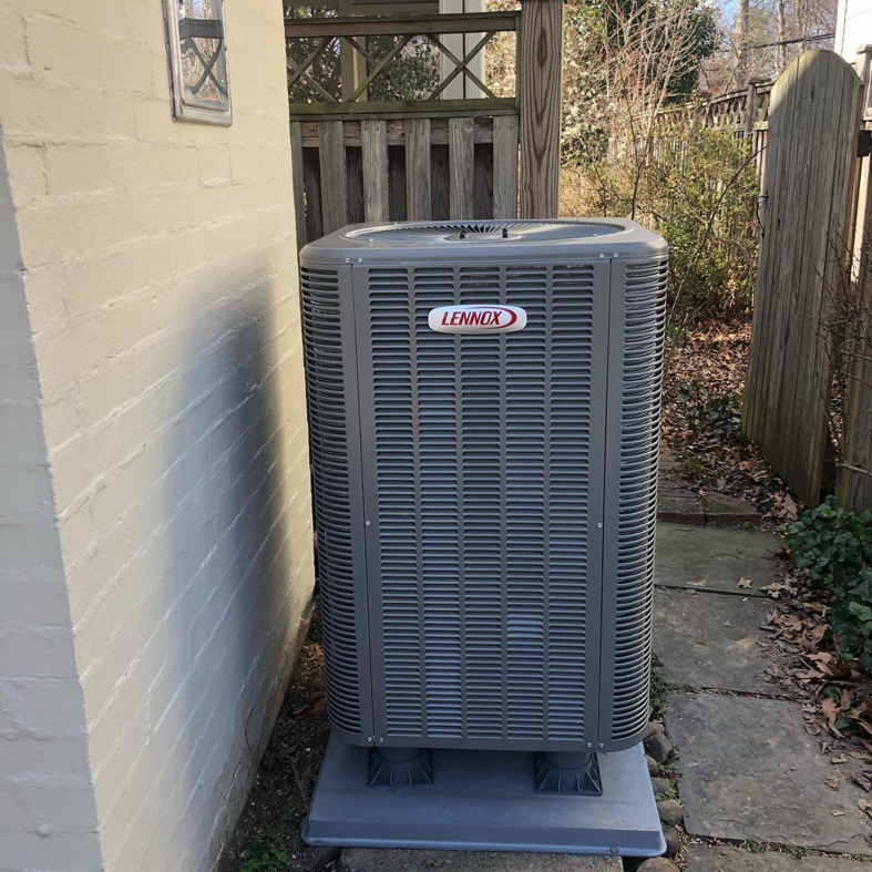 A modern outdoor Lennox air conditioning unit installed by SFC Heating and A/C, LLC in Alexandria, VA.