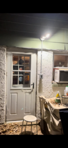 A newly installed outdoor light fixture and conduit on a building exterior by PnP Electric in Middletown, DE.