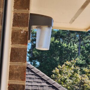 An outdoor light fixture installed on a brick wall by True Vine Electric in Raleigh, NC