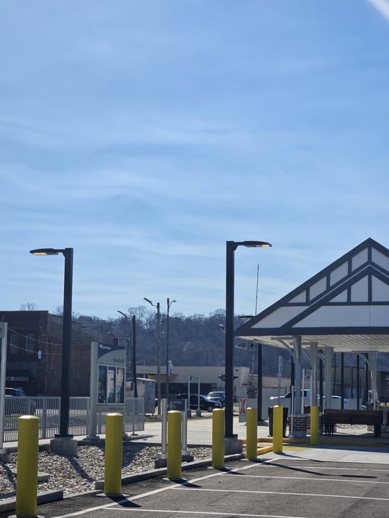Modern outdoor lighting fixtures installed at a public transit station by Apex Electric LLC in Brea, CA.
