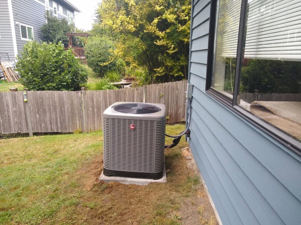 An outdoor mini-split condenser unit installed by Dynamic Utility Services, Inc. Heating, A/C & Refrigeration in Shoreline, WA.