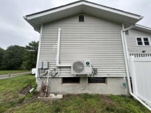 An outdoor mini-split condenser unit installed on the side of a house by Express Home Services LLC in Las Vegas, NV
