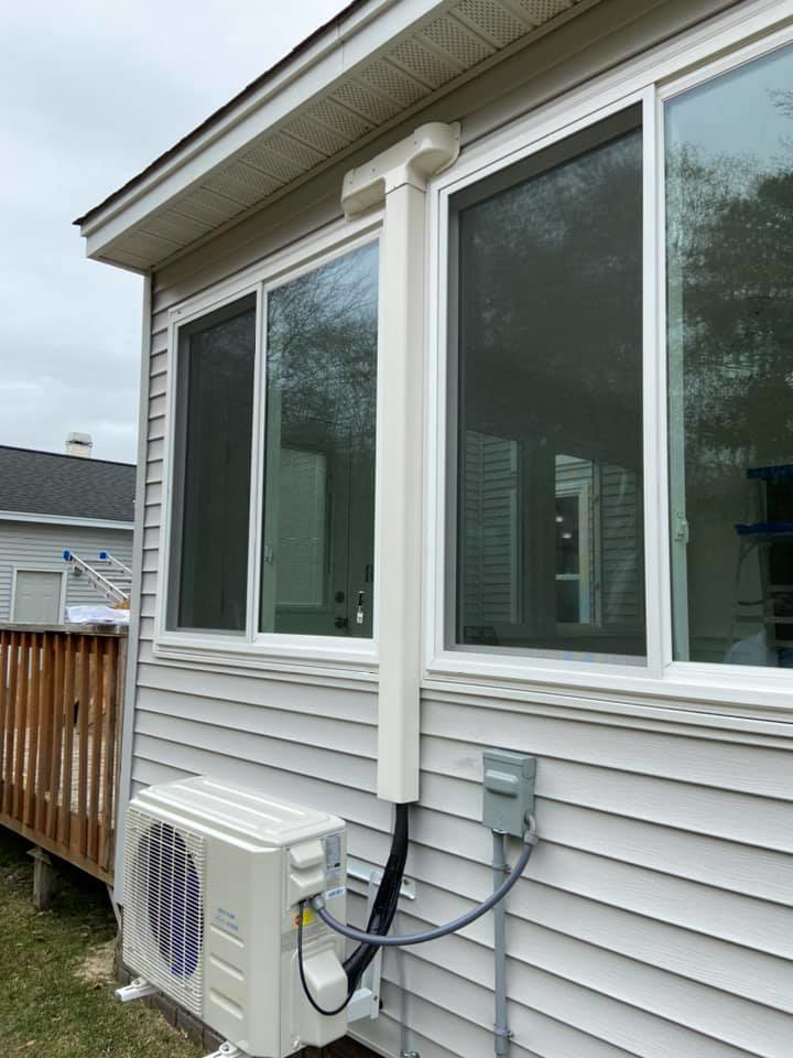 Outdoor mini-split condenser unit installed on a residential property by Turner & Son's Heating and Air in Anderson, IN