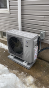 An outdoor mini-split condenser unit installed by Viking Mechanical LLC, offering HVAC solutions in Rapid City, SD.