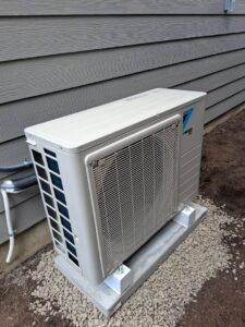 An outdoor mini-split condenser unit installed by Elevate Heating & Cooling in Hillsboro, OR.