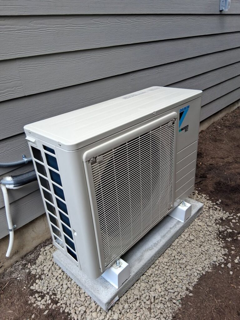 An outdoor mini-split condenser unit installed by Elevate Heating & Cooling in Hillsboro, OR.