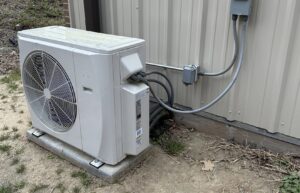 An outdoor mini-split condenser unit professionally installed by Lee Air Conditioning in Lafayette, LA.