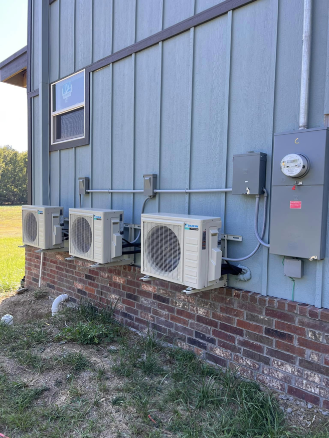 Multiple outdoor Daikin mini-split condenser units installed on a building by Smartcool Inc. in Pine Bluff, AR.