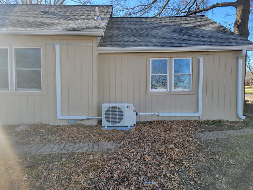 An outdoor mini-split condenser unit with line sets installed by Vega Heating and Cooling in Kansas City, KS