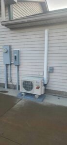 An outdoor mini-split HVAC unit professionally installed by Blue Fox Heating & Cooling in Lebanon, IN.