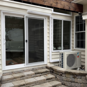 An outdoor mini-split HVAC unit installed next to a home, serviced by Cool Runnings HVAC LLC in Salisbury, MD.