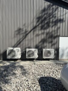 Three outdoor mini-split HVAC units installed on a commercial building by Brad Emberton's HVAC in Owensboro, KY.