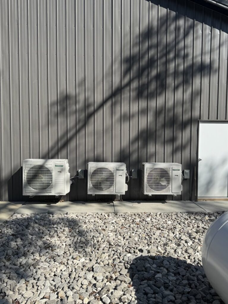 Three outdoor mini-split HVAC units installed on a commercial building by Brad Emberton's HVAC in Owensboro, KY.