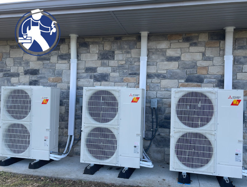 Outdoor mini-split HVAC units installed on a building by Fayette Plumbing & HVAC in Lexington, KY.