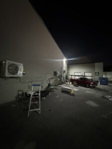 Outdoor mini-split HVAC units and equipment installed at night by Federal Heating & Cooling in Dresden, OH.