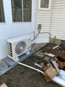An outdoor mini-split or heat pump condenser unit installed by Handy Properties LLC in Akron, OH.