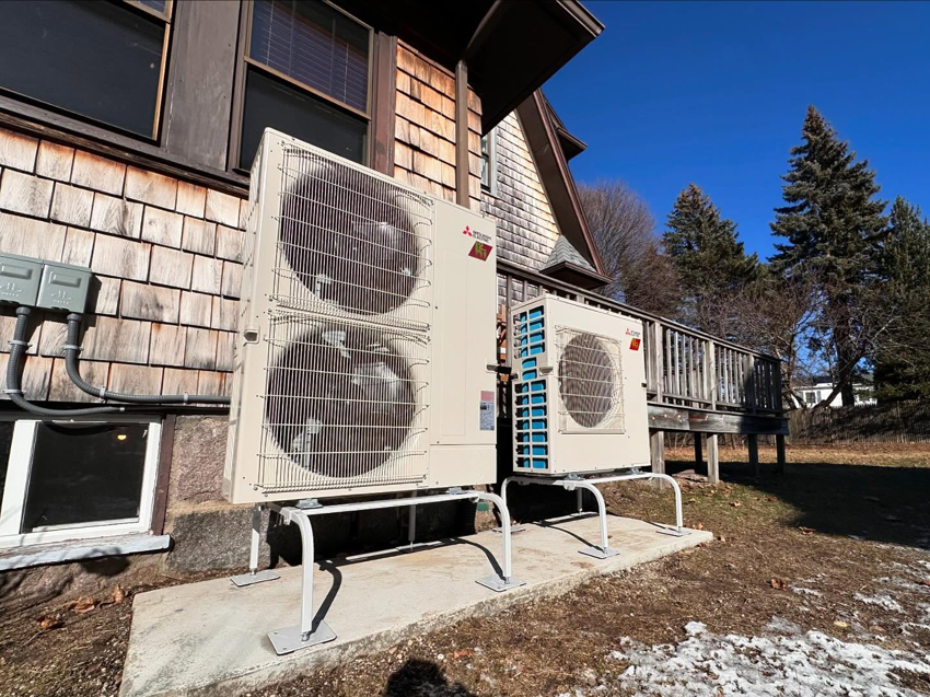 Two outdoor Mitsubishi HVAC condenser units installed by ComfortCool Mass in Quincy, MA