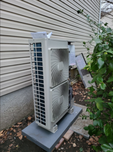 An outdoor multi-zone mini-split unit being serviced by Zibi Construction in Mount Prospect, IL.