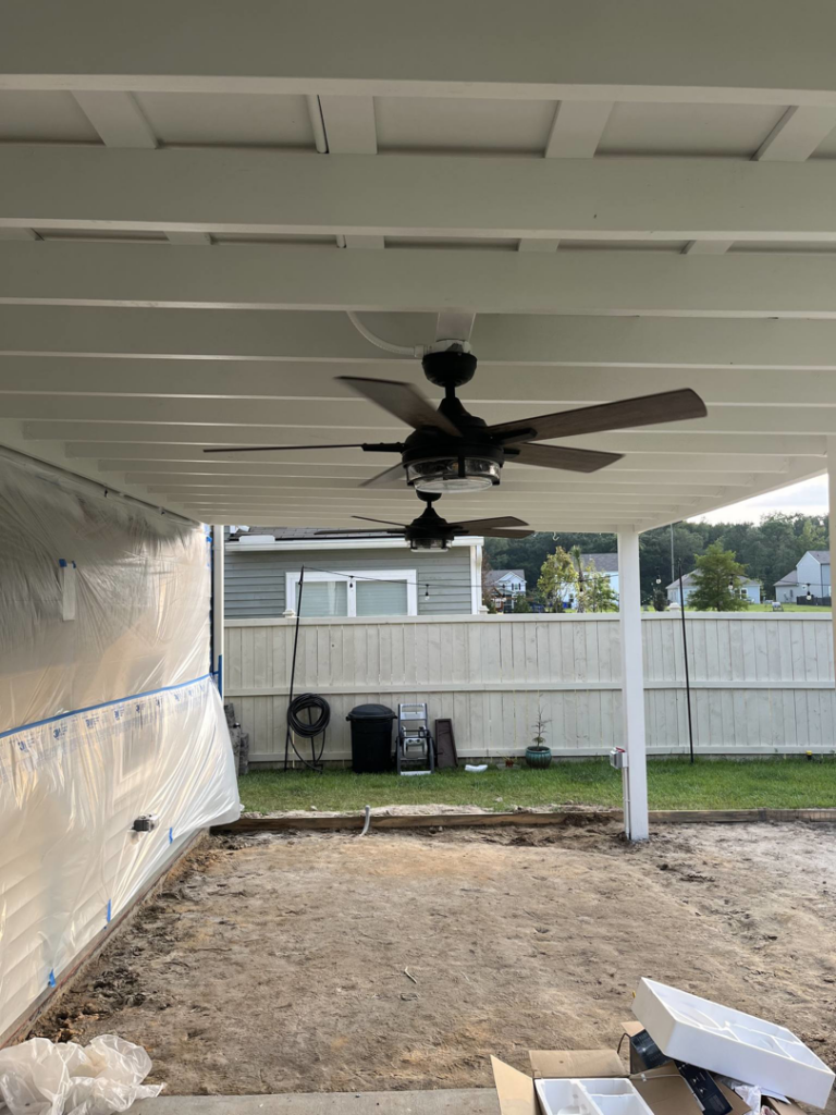 Two ceiling fans installed on an outdoor patio ceiling by Strother & Son Electric in Mount Pleasant, SC.