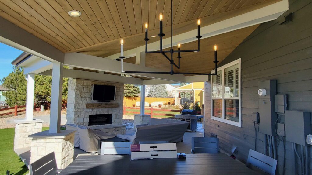 Outdoor patio with a stylish chandelier and recessed lighting installed by Access Electrical in Indianapolis, IN.