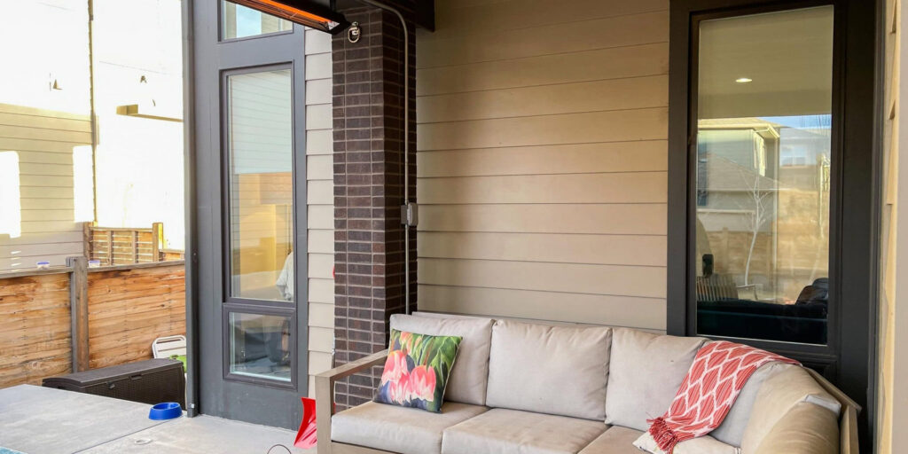 An outdoor patio with an installed overhead heater, a service provided by Absolute Plumbing, Electrical, Heating & Air in Denver, CO
