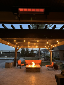 An outdoor patio with an installed Sunpak infrared heater, showcasing heating services by Hansen HVAC & Plumbing Services, Inc. in West Jordan, UT.