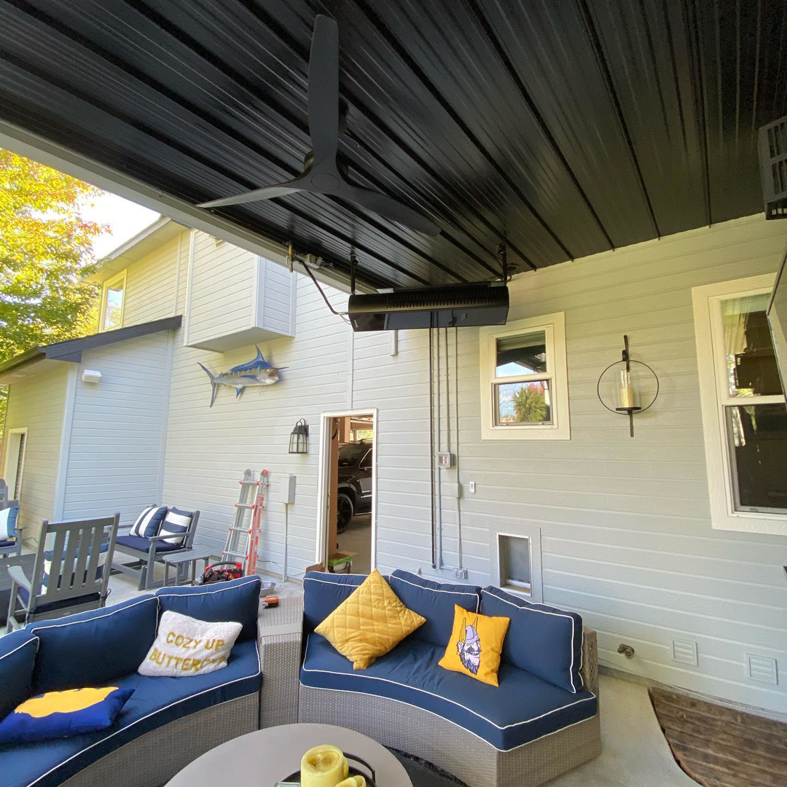 An outdoor patio featuring a newly installed radiant heater and ceiling fan by Mech-Masters, Inc. in Nampa, ID.