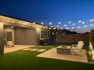 Beautiful outdoor patio lighting, including string lights and landscape lights, installed by R&M Electric LLC in Gilbert, AZ.