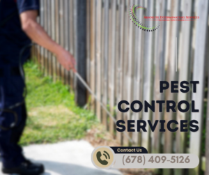 An outdoor pest control technician spraying along a fence line for Absolute Exterminating Services in Ellenwood, GA.