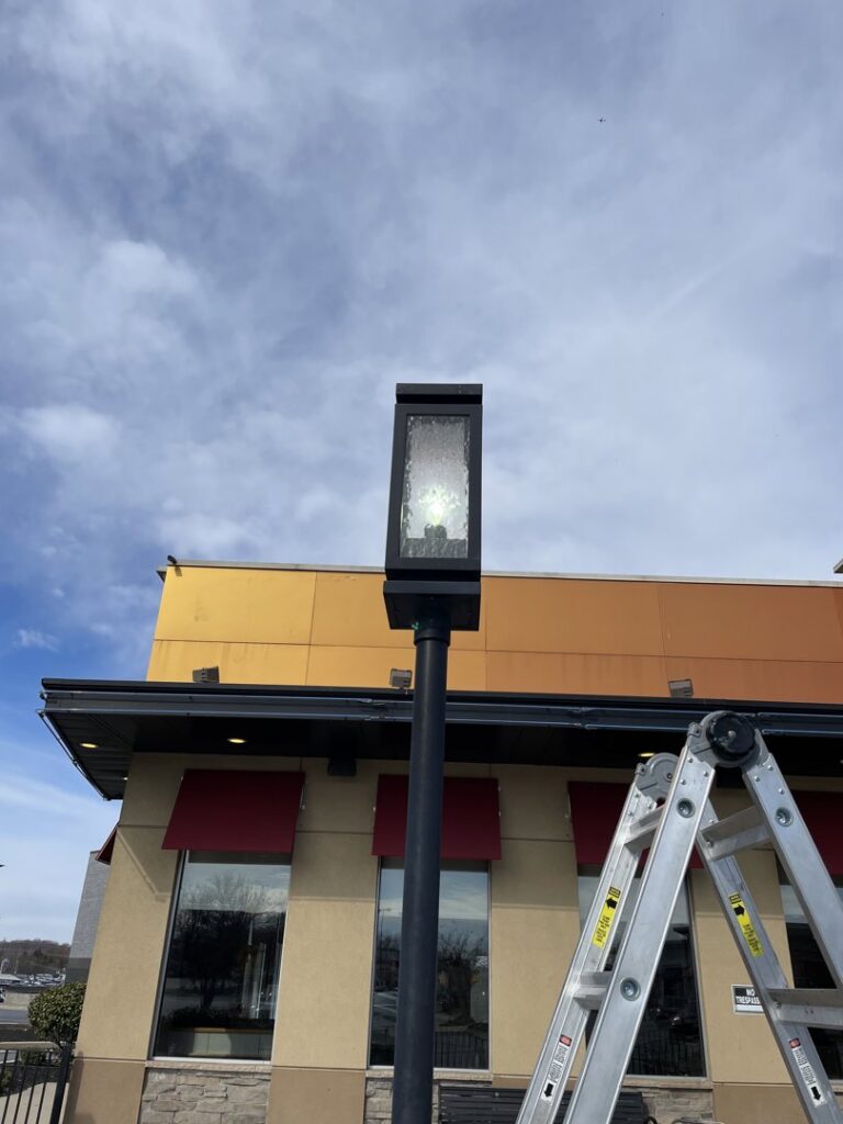 An outdoor pole light being installed or repaired by GBE. Lectrical LLC in Gaithersburg, MD