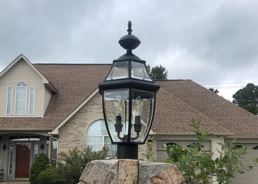 An outdoor post light with decorative bulbs installed in front of a home by Top Tier Electrical Services LLC in Knoxville, TN