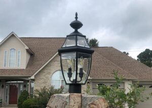 An outdoor post light with decorative bulbs installed in front of a home by Top Tier Electrical Services LLC in Knoxville, TN