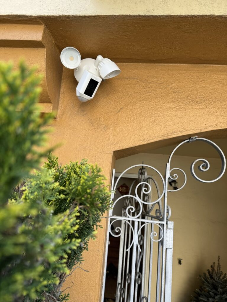 An outdoor security camera and floodlight combination professionally installed by Wisdom Electrical in San Francisco, CA.