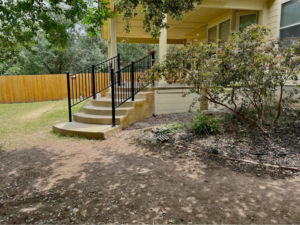 Custom black metal handrails installed on outdoor stairs by Down South Welding and Fabrication in Canyon Lake, TX.