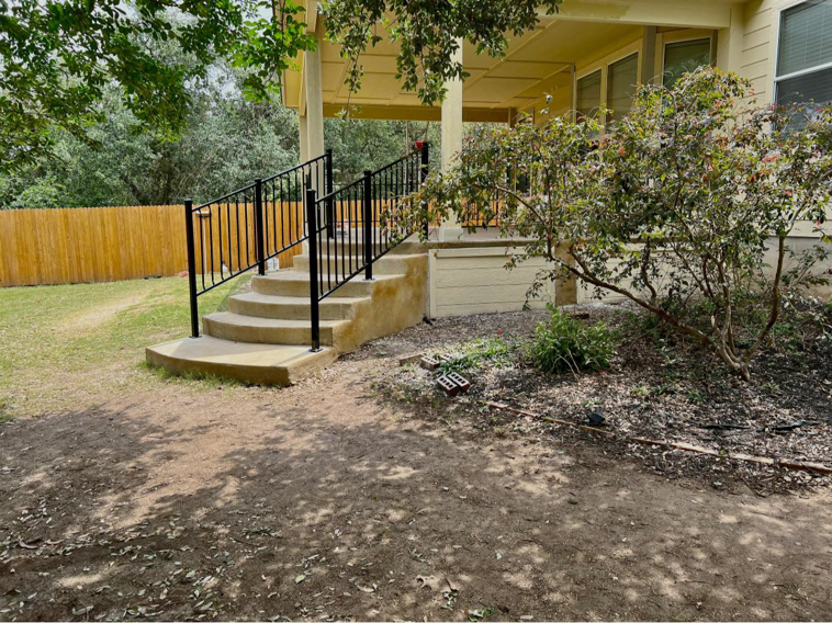 Custom black metal handrails installed on outdoor stairs by Down South Welding and Fabrication in Canyon Lake, TX.