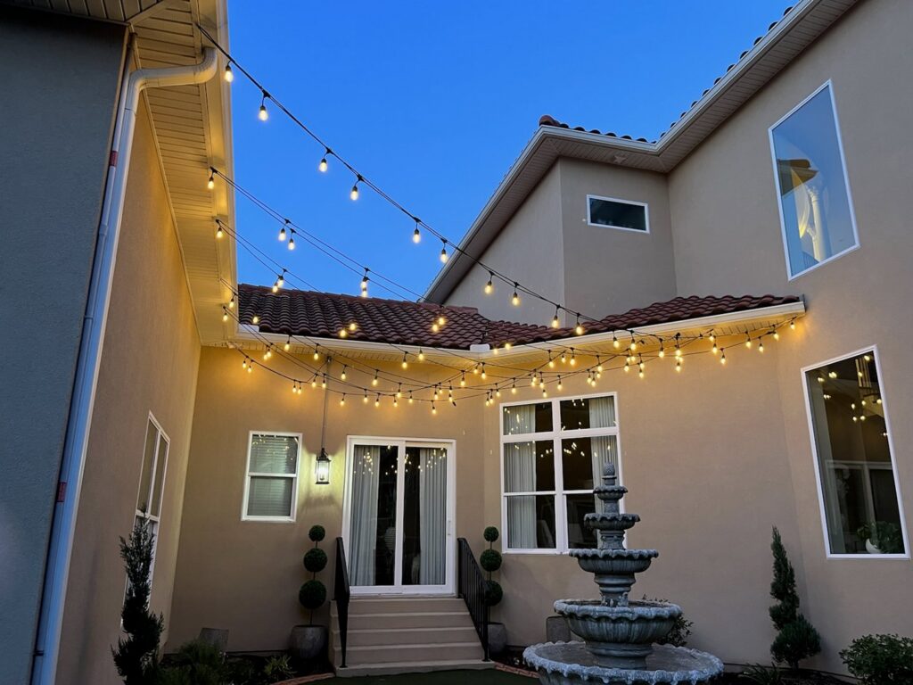 Decorative outdoor string lights professionally installed on a patio by Mister Sparky of Columbia in West Columbia, SC.