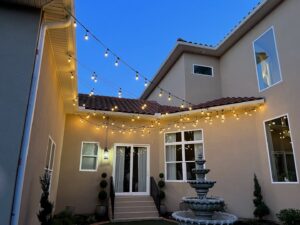 Decorative outdoor string lights professionally installed on a patio by Mister Sparky of Columbia in West Columbia, SC.