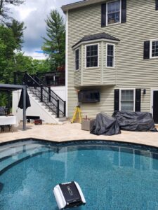 Outdoor TV mounting and electrical setup by the poolside by Julio A Lopez Electrician in Lowell, MA.