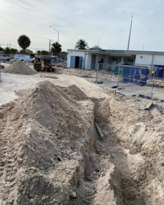 Outdoor underground electrical conduit installation at a construction site by Canseco Electrical Contractors, Inc. in Miami, FL.