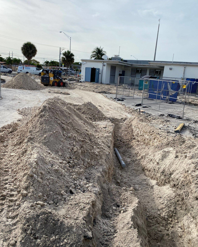 Outdoor underground electrical conduit installation at a construction site by Canseco Electrical Contractors, Inc. in Miami, FL.