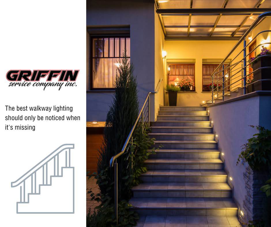 Professionally installed outdoor walkway lighting illuminating stairs at night by Griffin Service Company in Tampa, FL