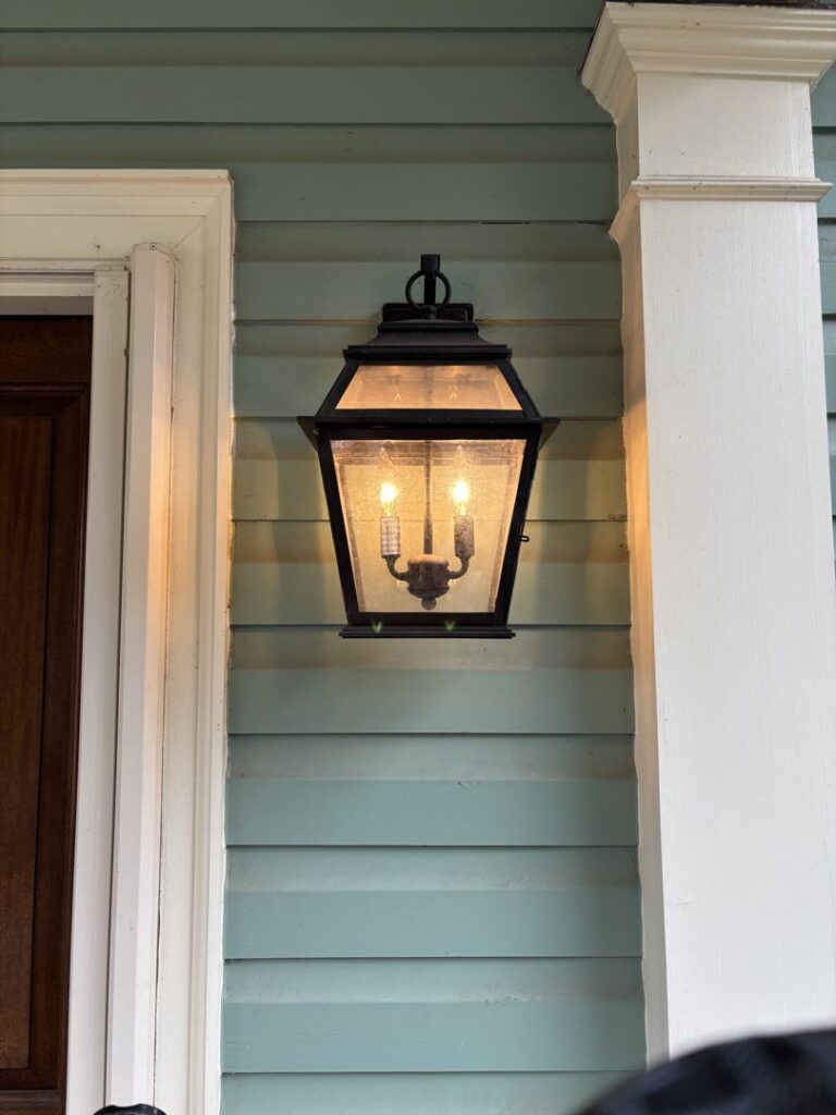 An outdoor wall lantern installed on a home by Onsite Electrical Services in Raleigh, NC.