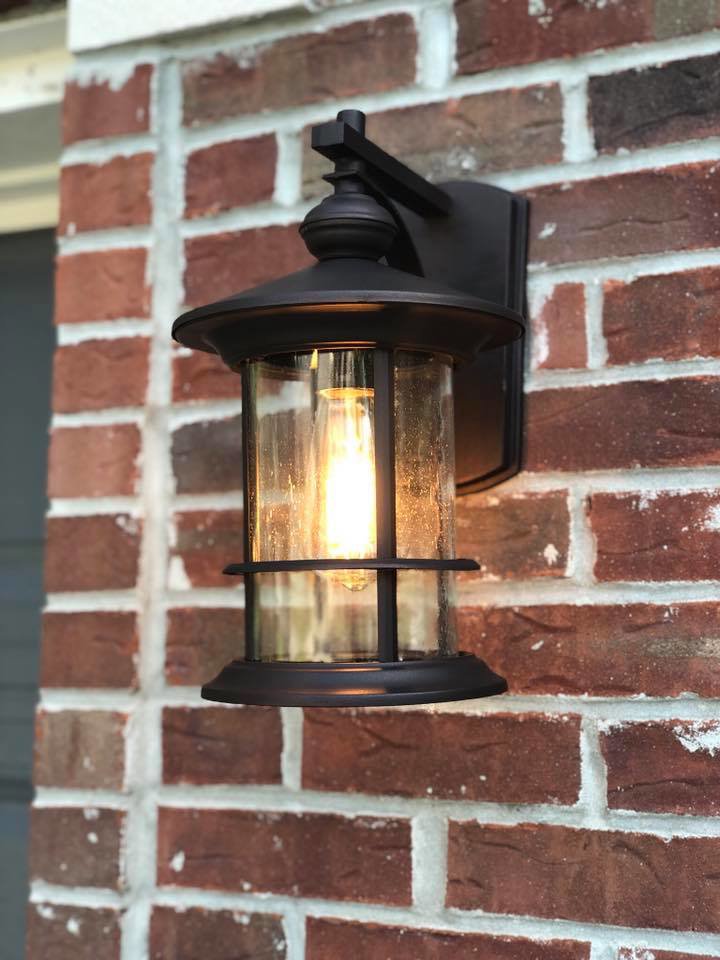 A classic outdoor wall lantern installed on a brick exterior by TGR Electric LLC in Carmel, IN.